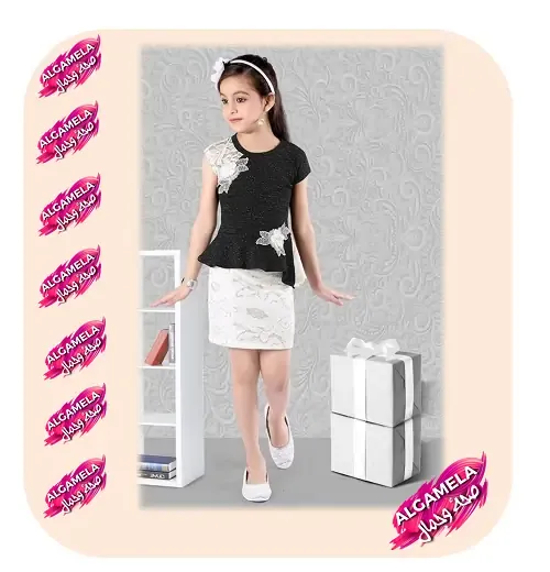 ثوب حفلات اطفال أسود وأبيض مزين بالورود عند الكتف والخصر